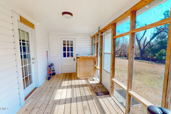 a view of a living room with a furniture and floor to ceiling window