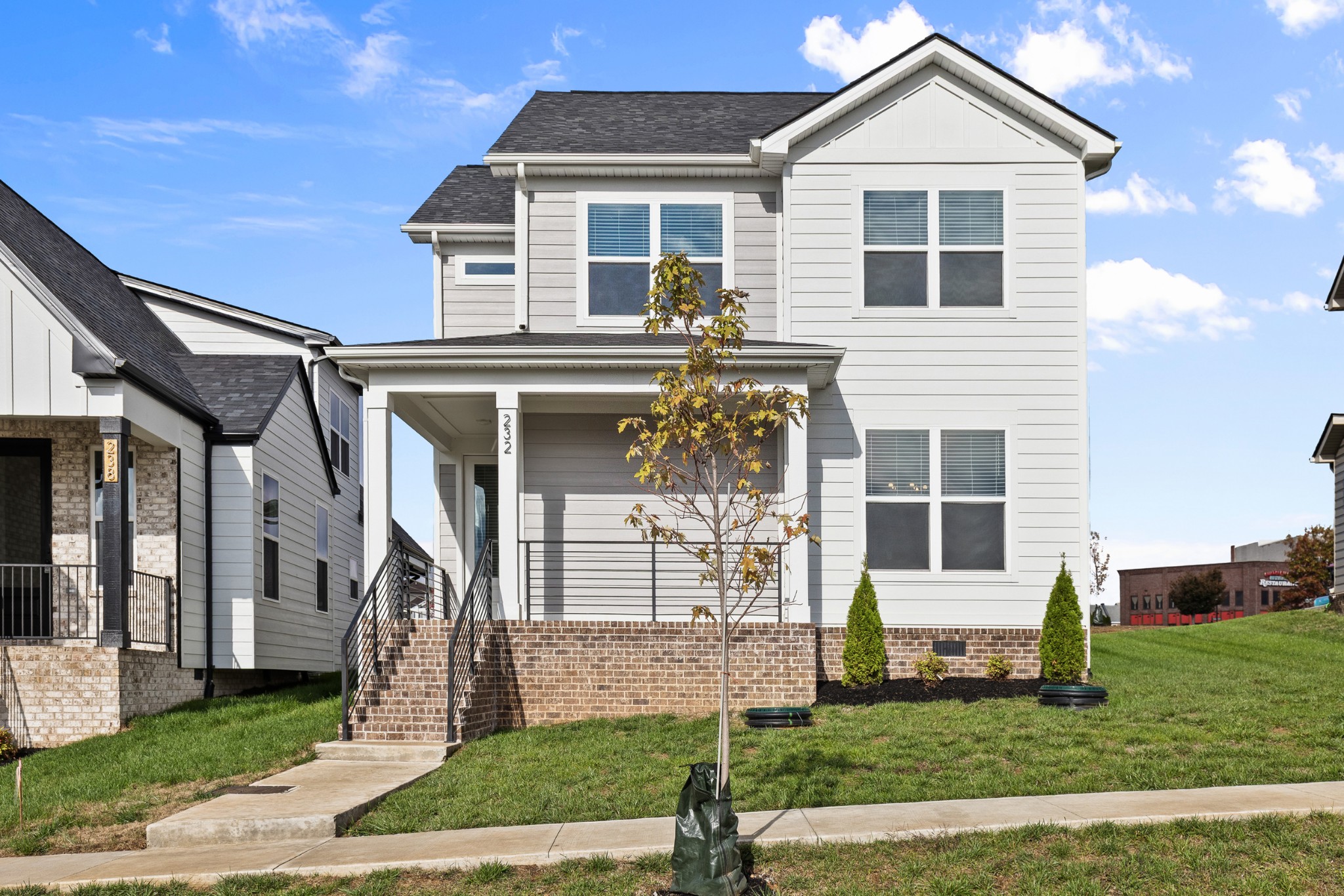 a front view of a house with a yard