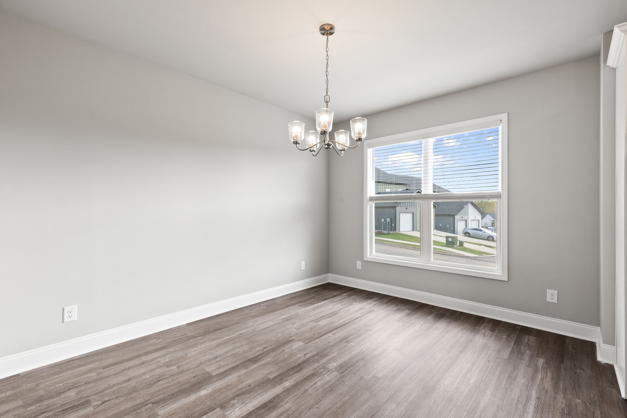 232 Franklin Street Pleasant View, TN 37146 - Photo 21 of 49 an empty room with wooden floor and windows