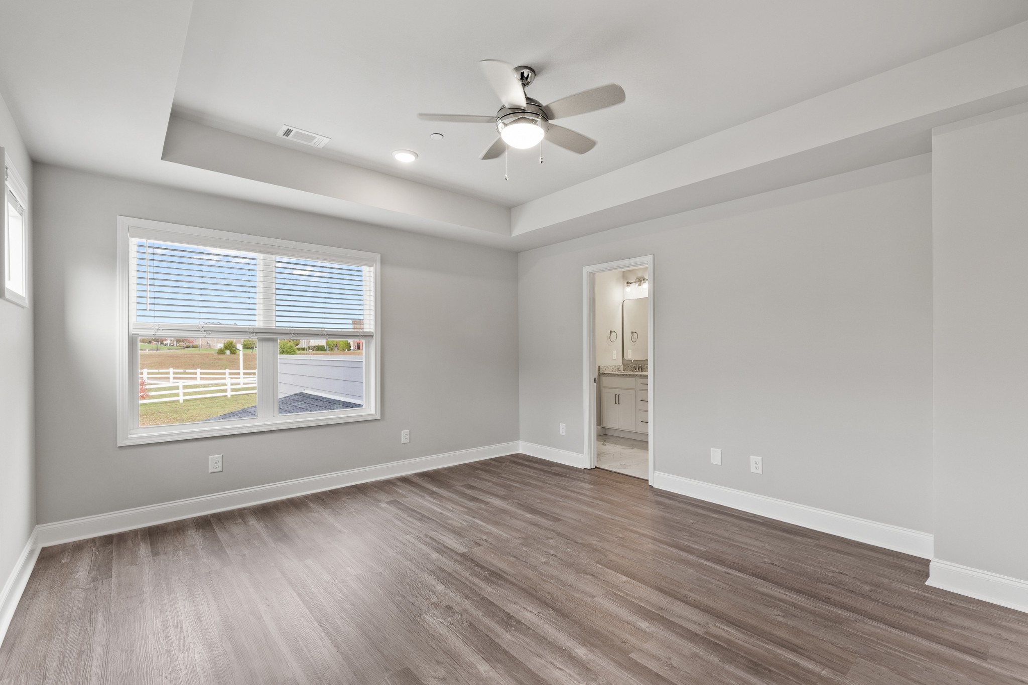 232 Franklin Street Pleasant View, TN 37146 - Photo 23 of 49 an empty room with wooden floor and windows