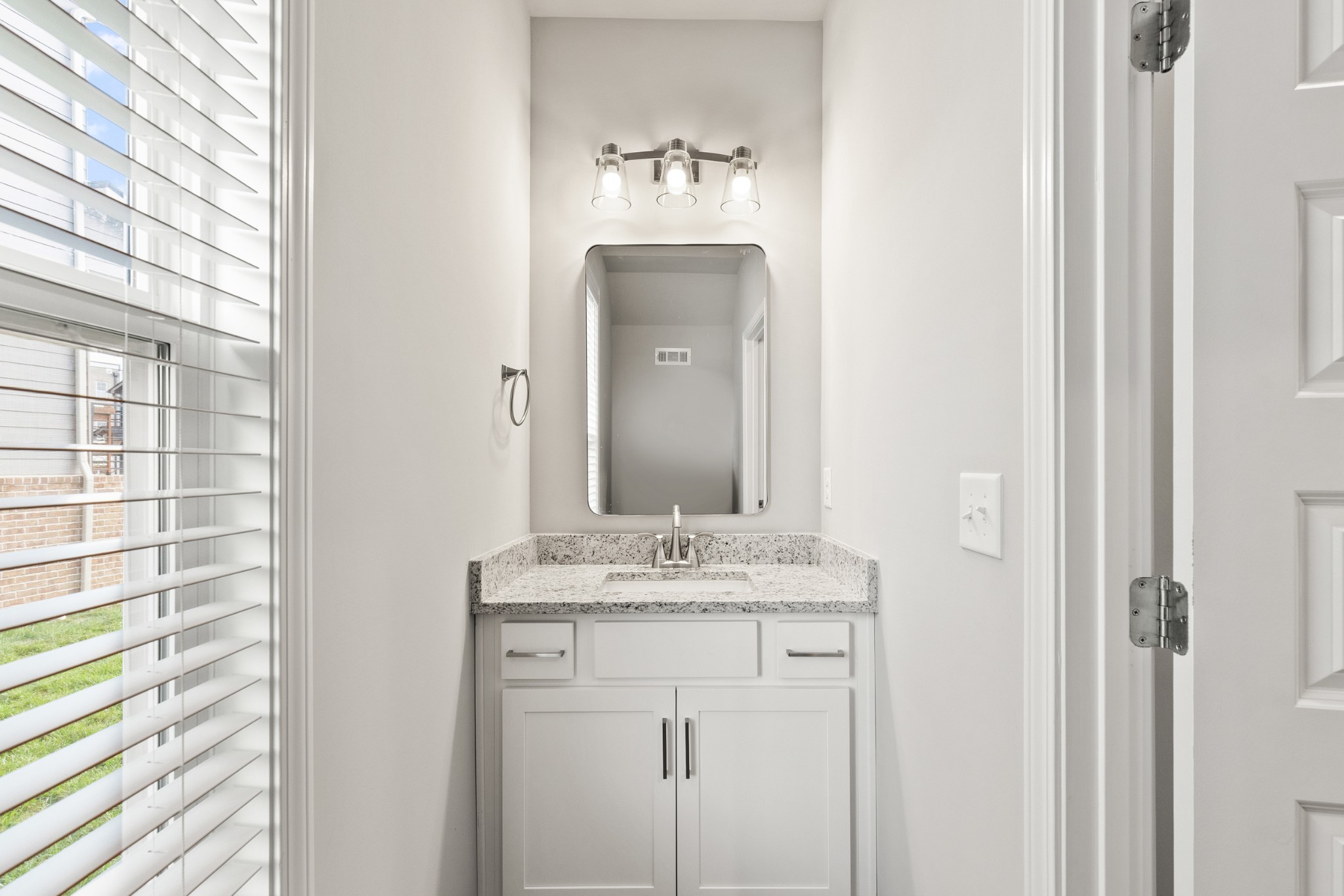 232 Franklin Street Pleasant View, TN 37146 - Photo 34 of 49 a bathroom with a sink and a mirror