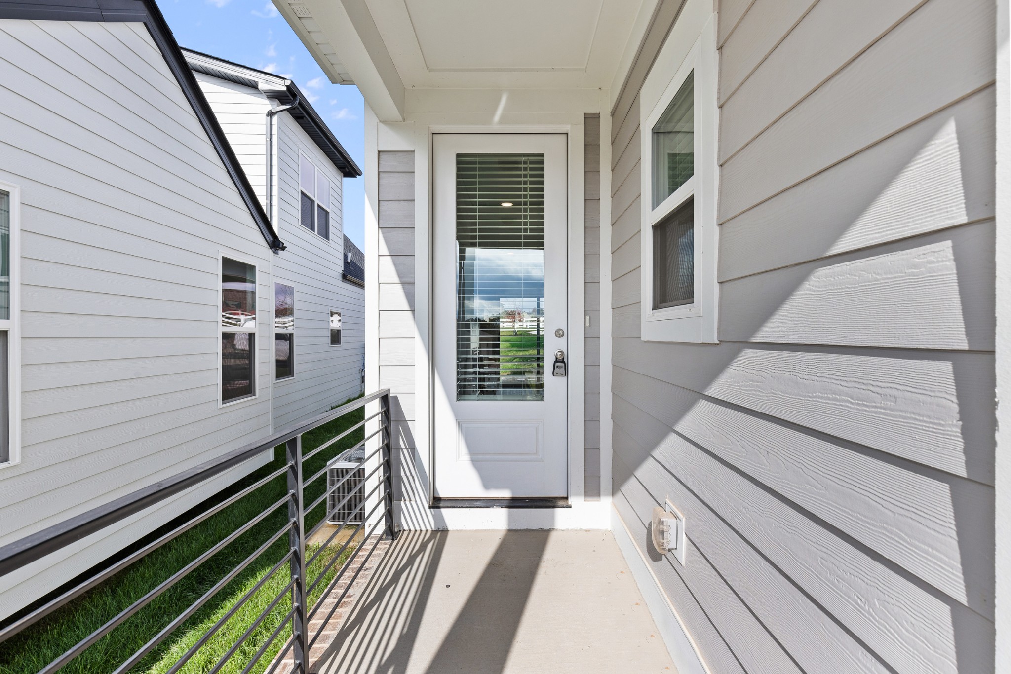 232 Franklin Street Pleasant View, TN 37146 - Photo 8 of 49 a view of a balcony with wooden floor and stairs