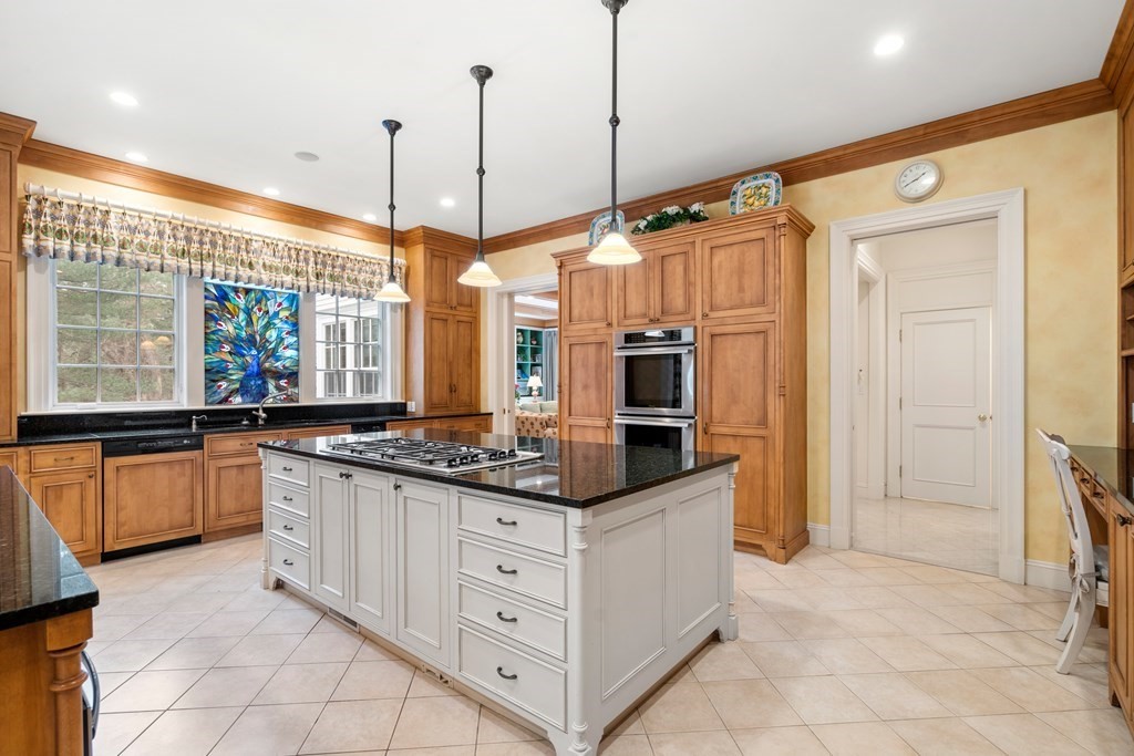25 Bridle Pth Path Weston, MA 02493 - Photo 12 of 32 a kitchen with stainless steel appliances granite countertop a stove a sink and a refrigerator