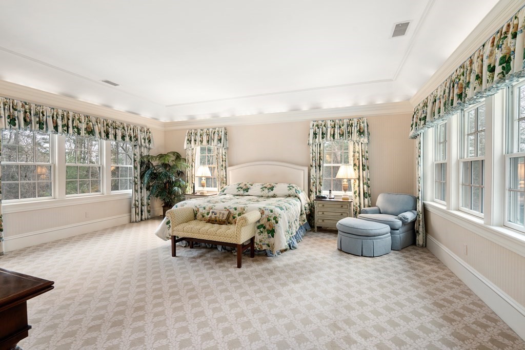 25 Bridle Pth Path Weston, MA 02493 - Photo 15 of 32 a spacious bedroom with a bed and a large window