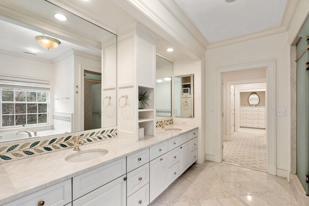 25 Bridle Pth Path Weston, MA 02493 - Photo 17 of 32 a bathroom with double sink and a mirror
