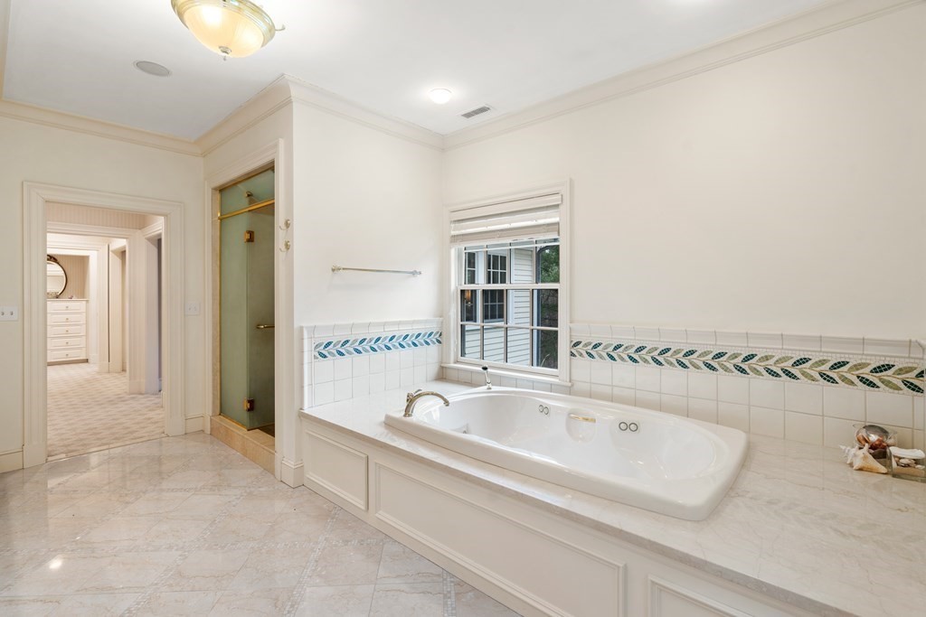 25 Bridle Pth Path Weston, MA 02493 - Photo 18 of 32 a bathroom with a bathtub and a shower