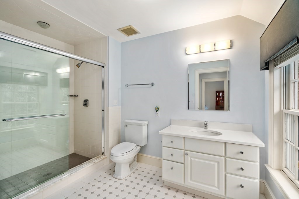 25 Bridle Pth Path Weston, MA 02493 - Photo 20 of 32 a bathroom with a sink a toilet and shower