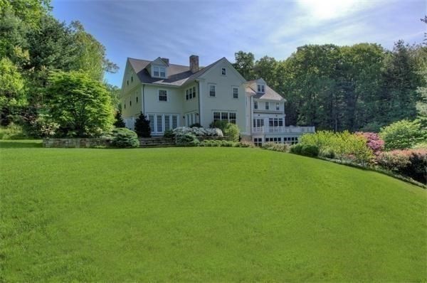 25 Bridle Pth Path Weston, MA 02493 - Photo 27 of 32 a front view of house with yard and green space