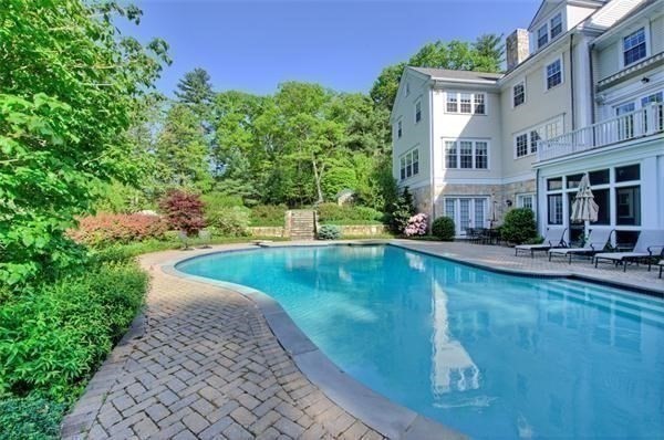 25 Bridle Pth Path Weston, MA 02493 - Photo 28 of 32 a view of a swimming pool with a patio