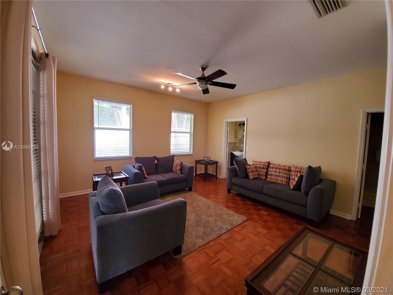 1405 Addison Avenue Boca Raton, FL 33486 - Photo 17 of 24 a living room with furniture and a large window