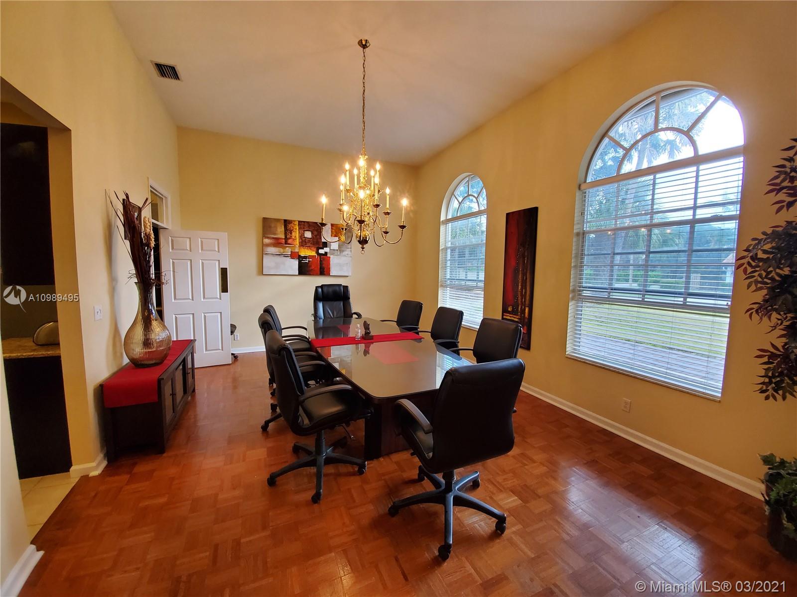 1405 Addison Avenue Boca Raton, FL 33486 - Photo 6 of 24 a view of a livingroom with furniture window and wooden floor