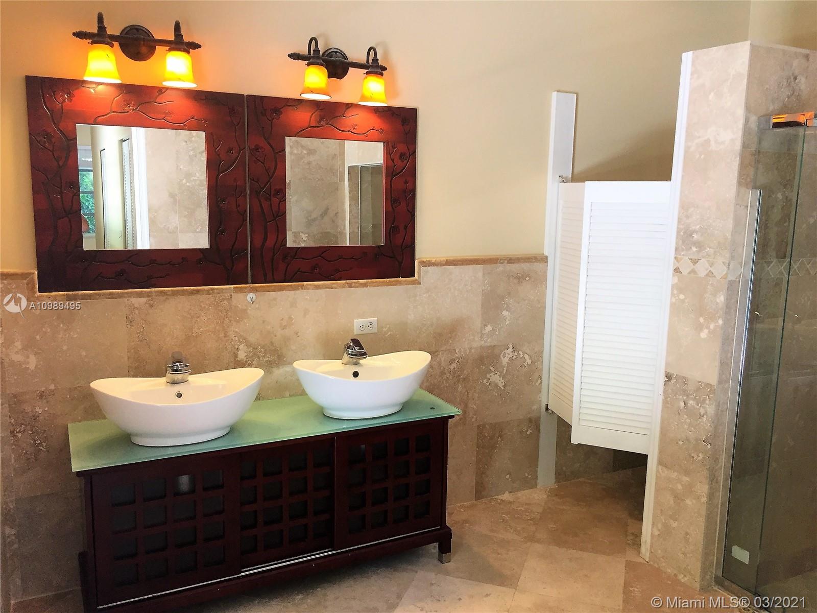 1405 Addison Avenue Boca Raton, FL 33486 - Photo 9 of 24 a bathroom with a sink and a mirror