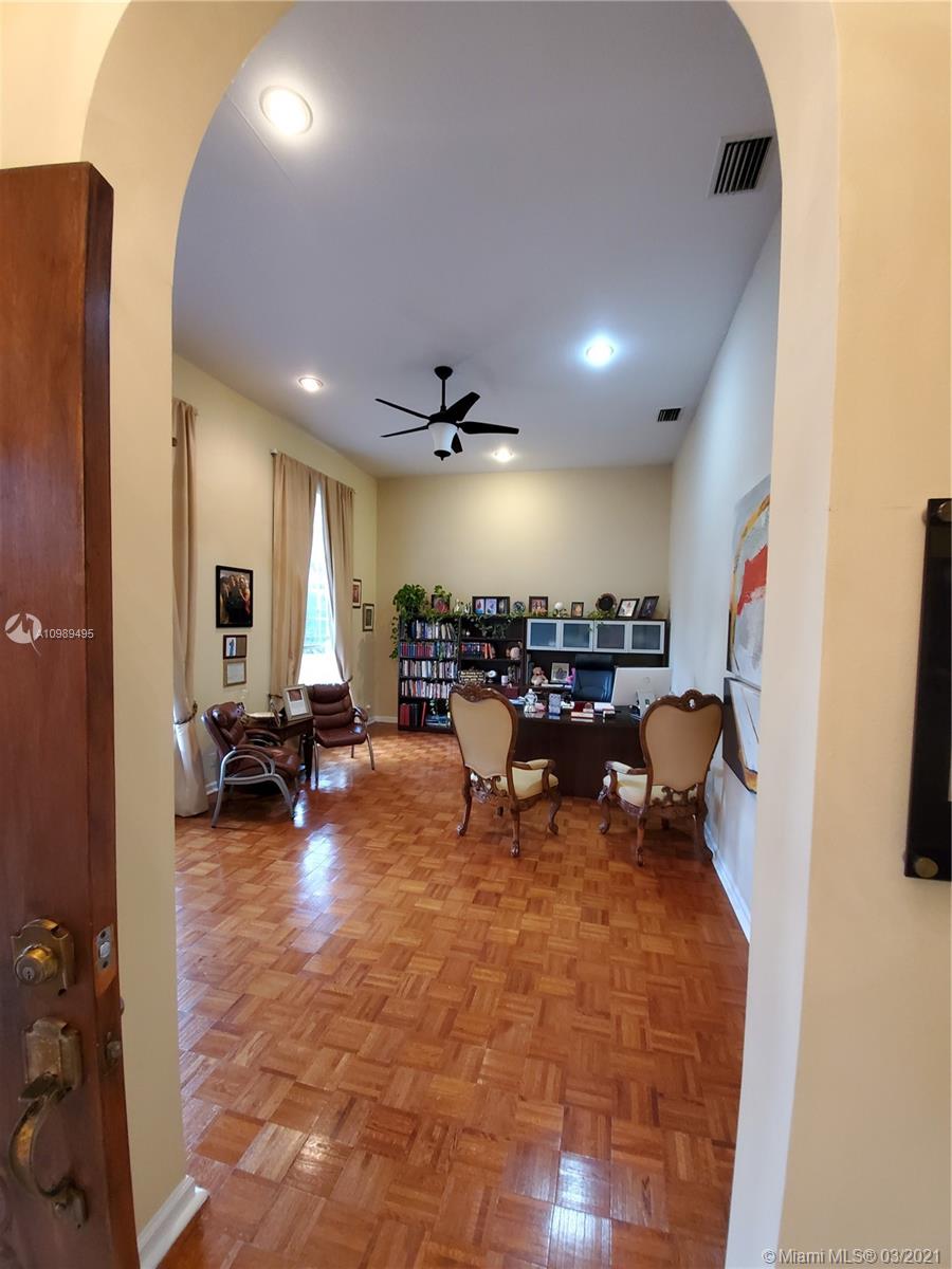 1405 Addison Avenue Boca Raton, FL 33486 - Photo 10 of 24 a group of people sitting in room with furniture