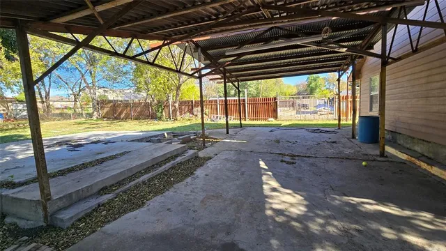 a view of a yard with table and chairs