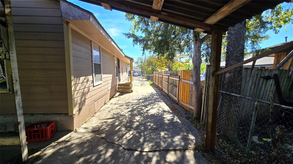 1441 Oakley Avenue Dallas, TX 75216 - Photo 28 of 34 a view of a pathway of a house with a tree