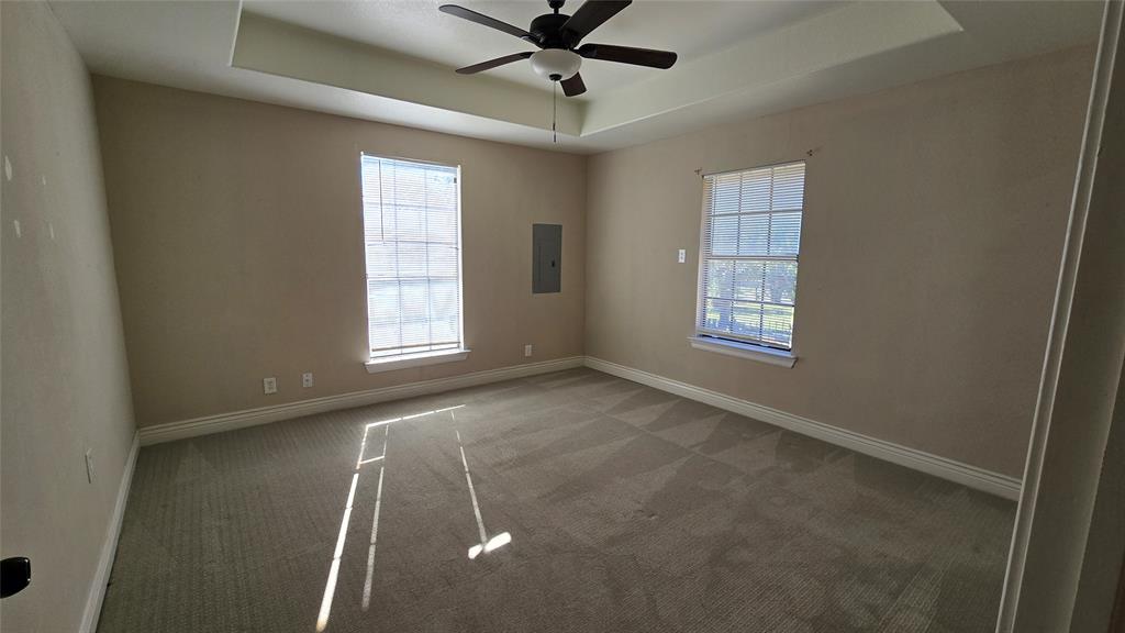 1441 Oakley Avenue Dallas, TX 75216 - Photo 7 of 34 an empty room with windows and fan