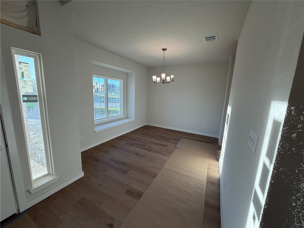 215 Whaley Street Caldwell, TX 77836 - Photo 14 of 14 an empty room with windows and entrance