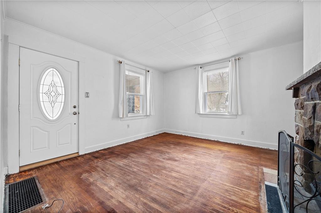 1341 Scrubgrass Road Carnegie, PA 15106 - Photo 5 of 21 a view of empty room with window and wooden floor