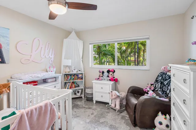 a kids room with toys and a window