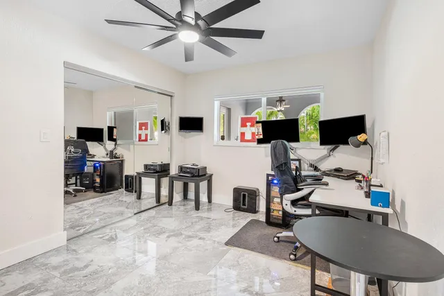 a bedroom with a bed and flat screen tv
