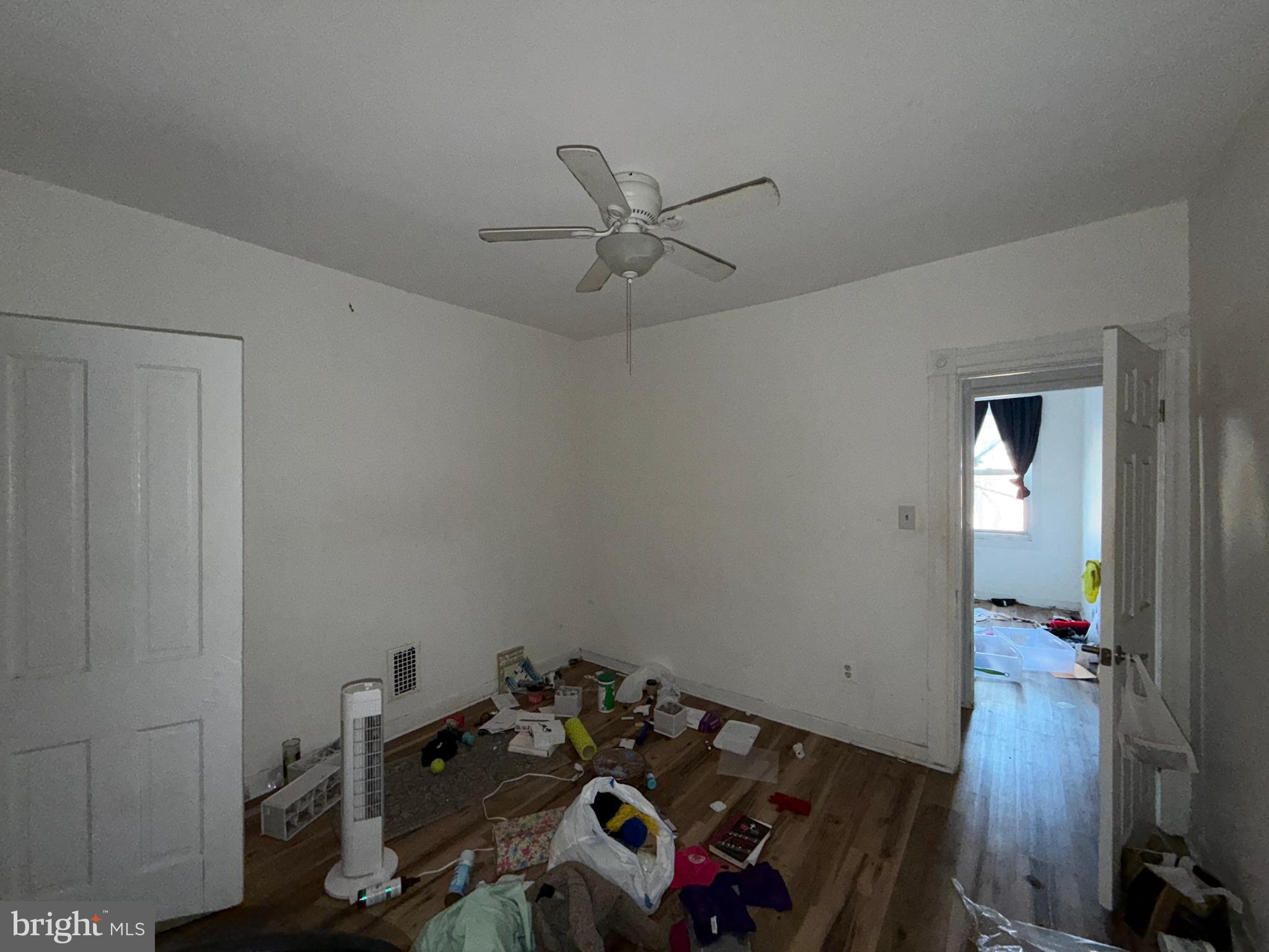 910 North Dukeland Street Baltimore, MD 21216 - Photo 15 of 27 a view of a workspace with furniture and closet