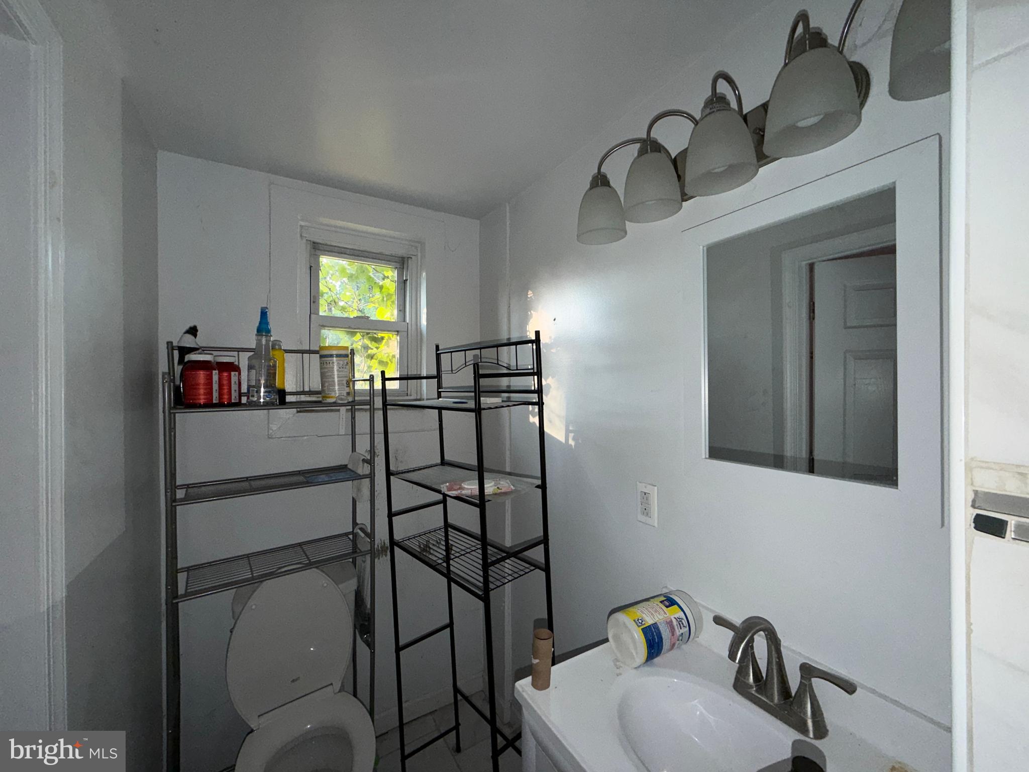 910 North Dukeland Street Baltimore, MD 21216 - Photo 19 of 27 a dining room with furniture and window