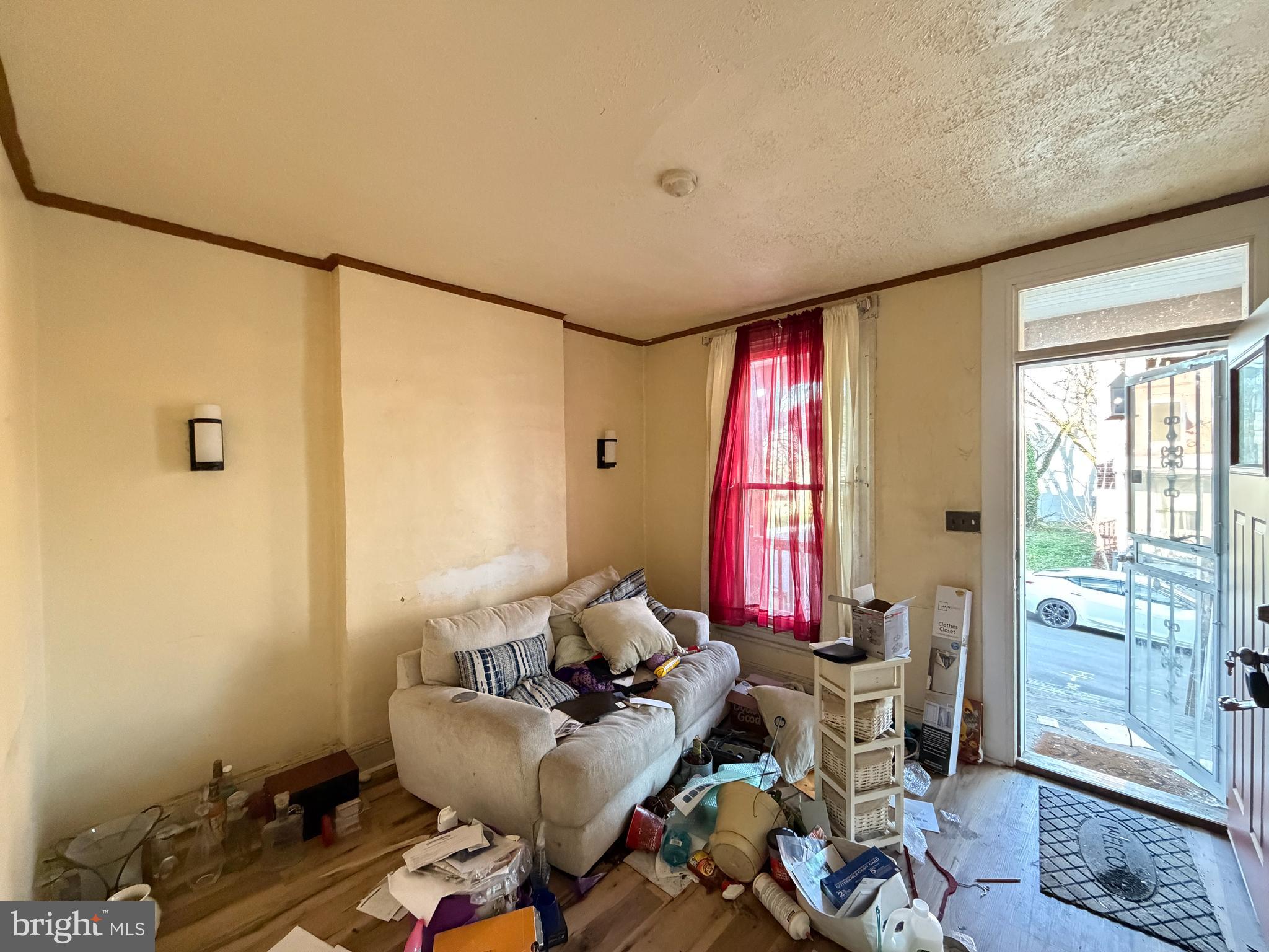 910 North Dukeland Street Baltimore, MD 21216 - Photo 4 of 27 a room with furniture and a window