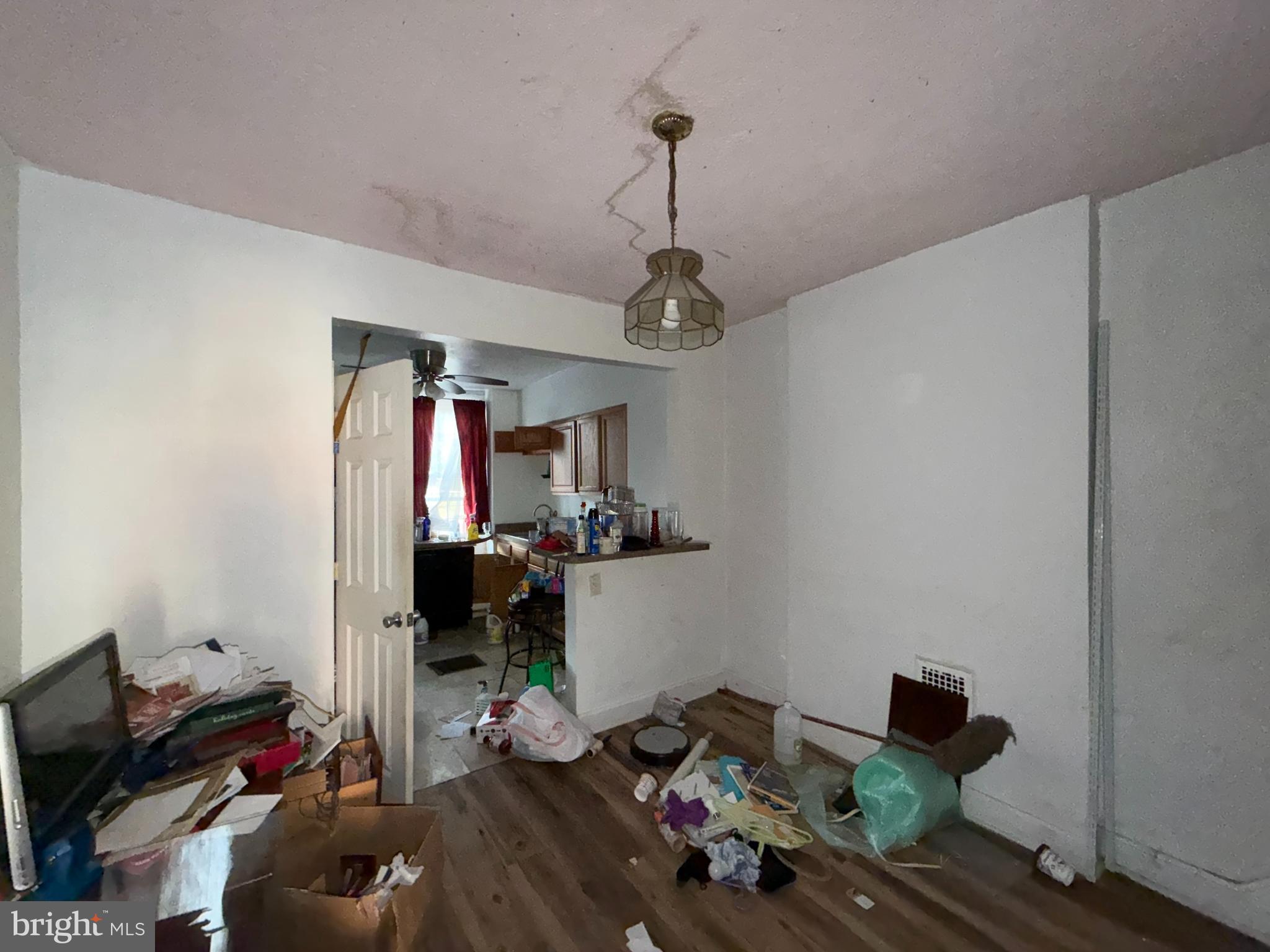 910 North Dukeland Street Baltimore, MD 21216 - Photo 5 of 27 a bedroom with a bed and wooden floor