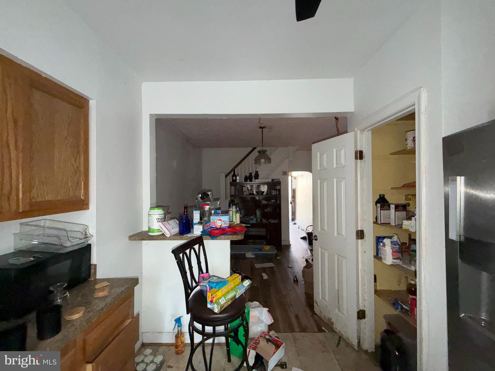 910 North Dukeland Street Baltimore, MD 21216 - Photo 10 of 27 a work room with furniture a rug and a window