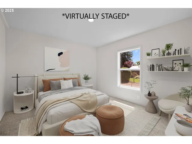 a bedroom with a bed and painting on the wall