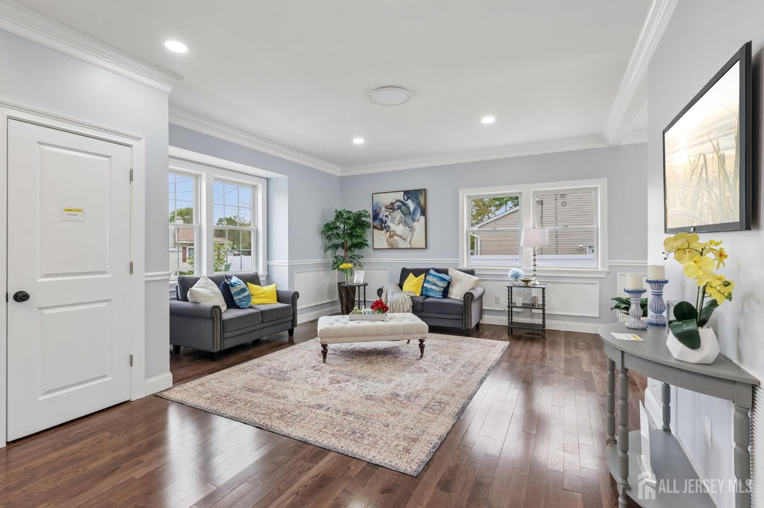 239 Suttons Lane Edison, NJ 08817 - Photo 11 of 68 a living room with furniture and wooden floor