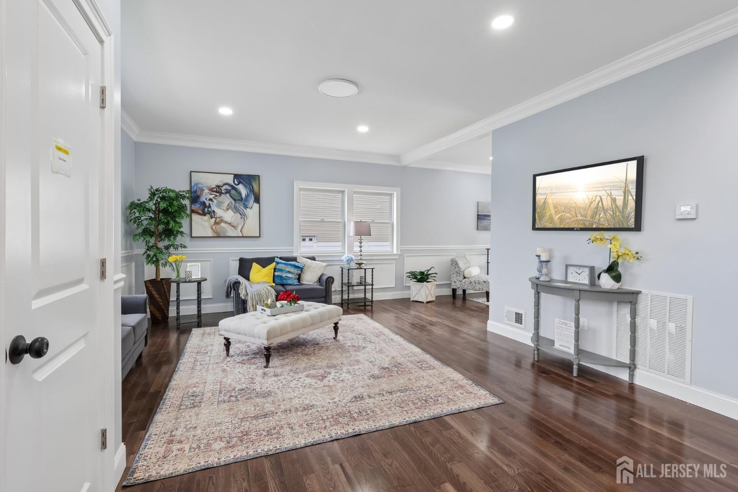 239 Suttons Lane Edison, NJ 08817 - Photo 12 of 68 a living room with furniture and a flat screen tv