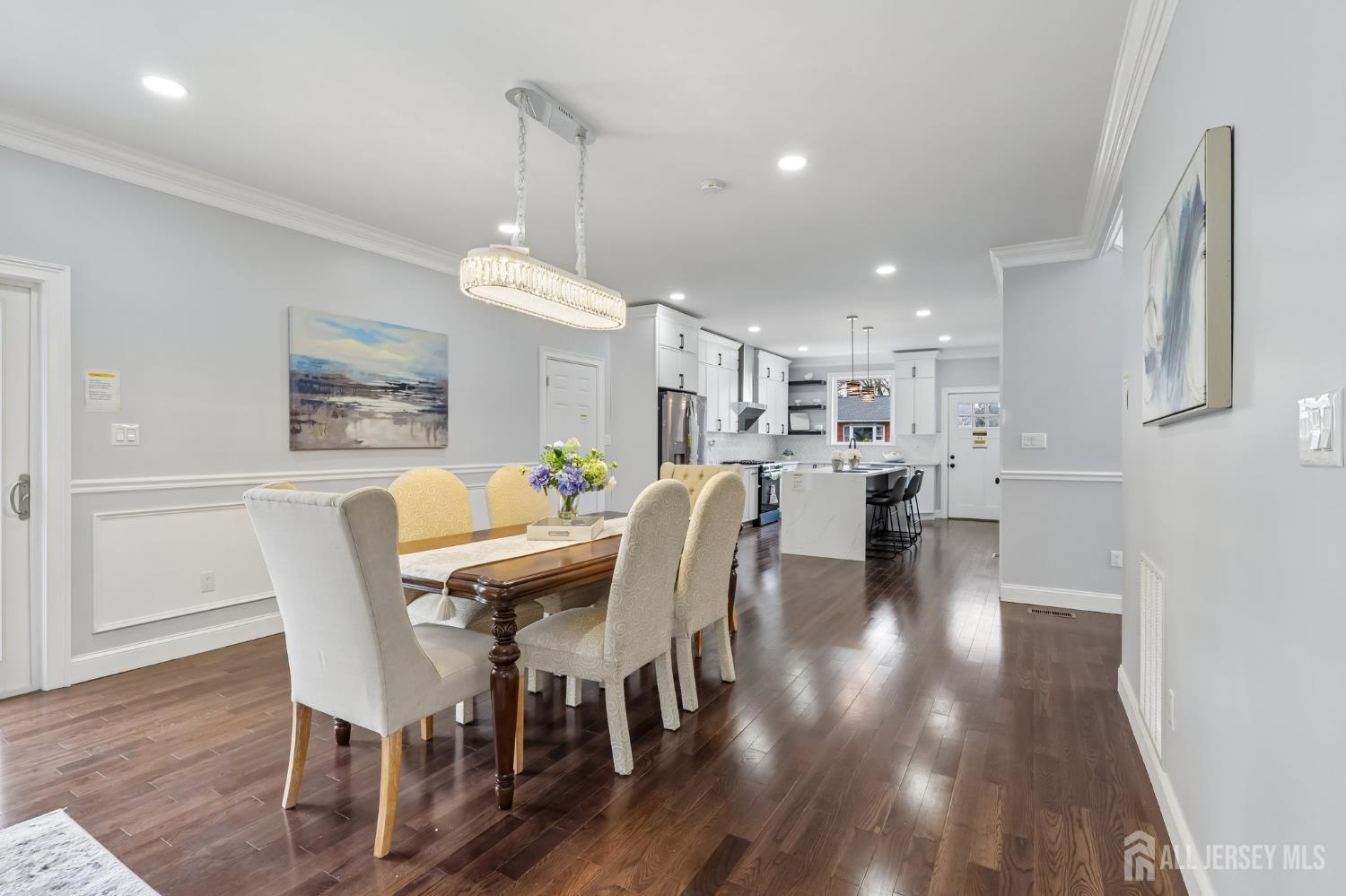 239 Suttons Lane Edison, NJ 08817 - Photo 14 of 68 a view of a dining room with furniture and wooden floor