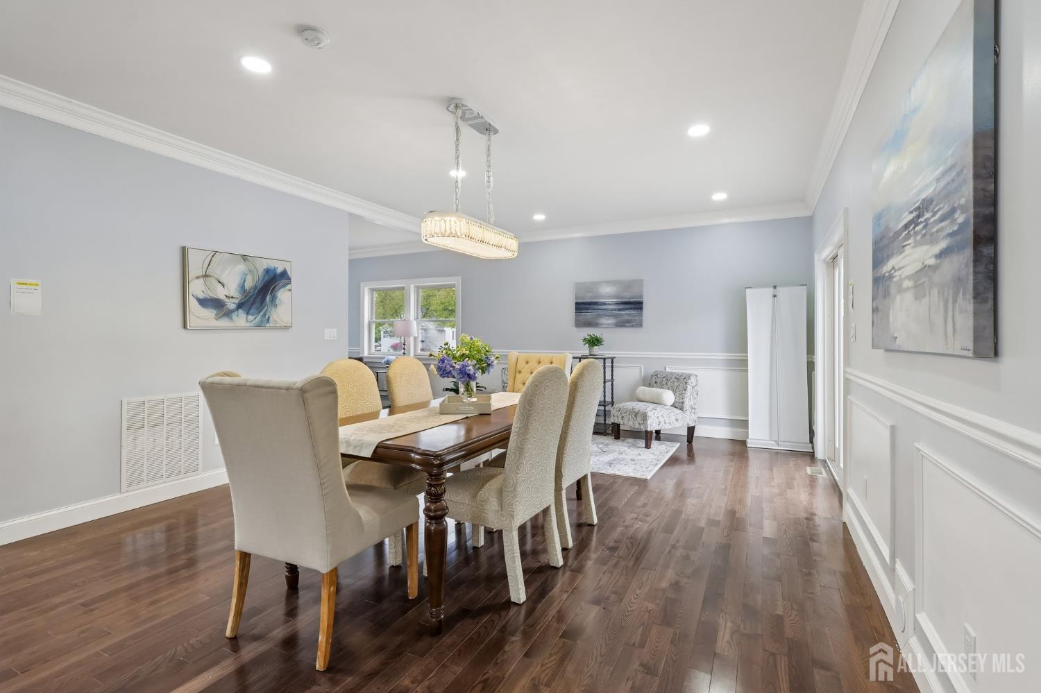 239 Suttons Lane Edison, NJ 08817 - Photo 16 of 68 a view of a dining room with furniture and wooden floor