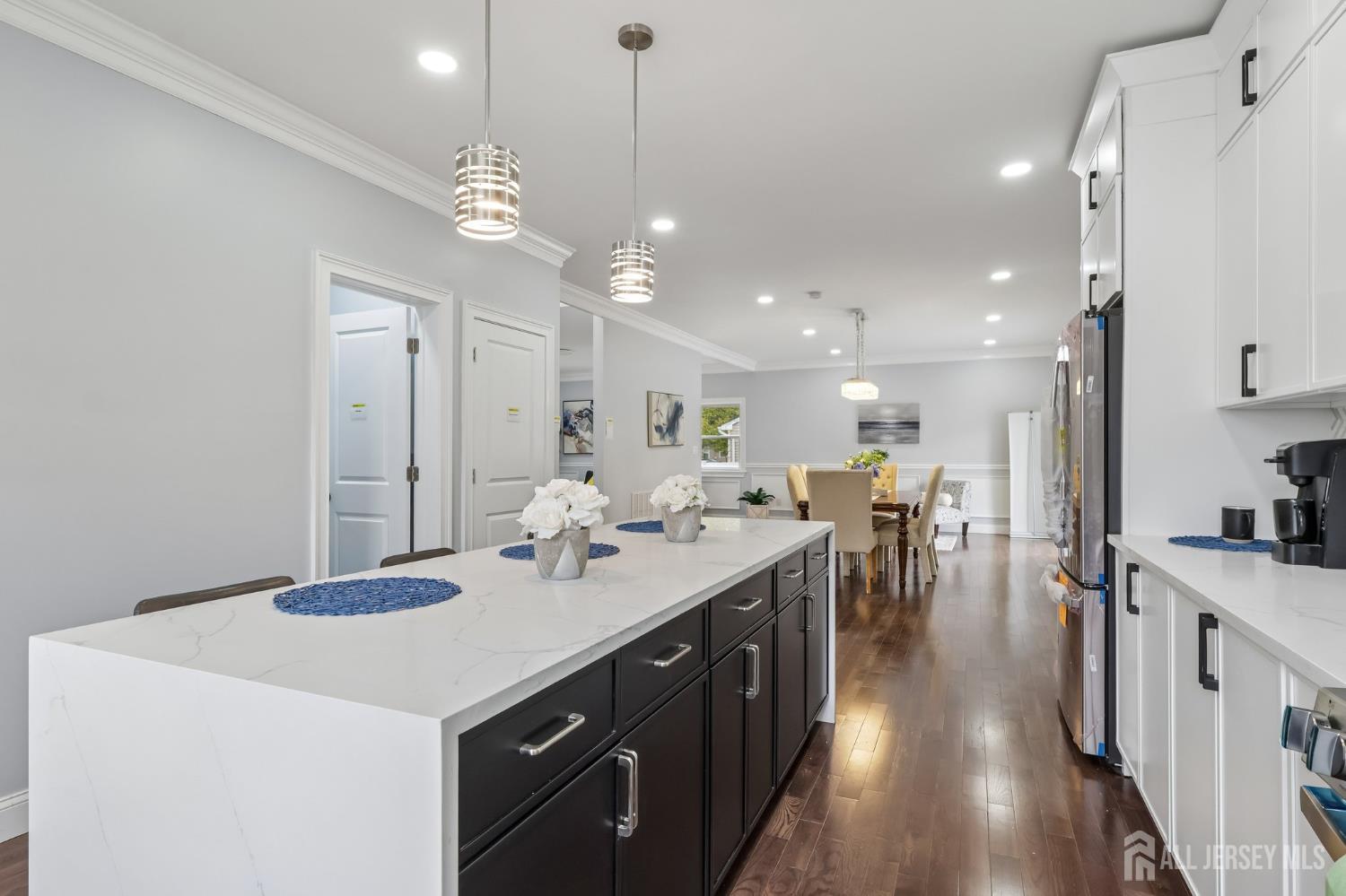 239 Suttons Lane Edison, NJ 08817 - Photo 20 of 68 a kitchen with lots of counter space a sink appliances and living room view