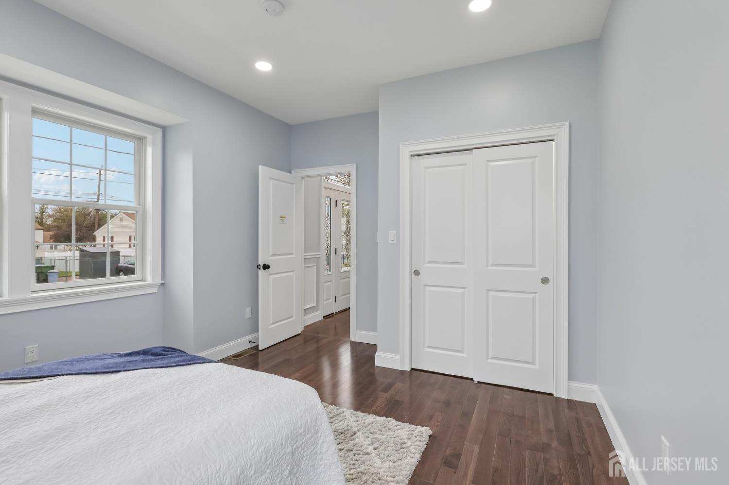 239 Suttons Lane Edison, NJ 08817 - Photo 32 of 68 a bedroom with a bed and a window
