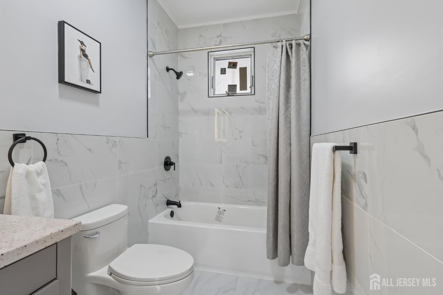 239 Suttons Lane Edison, NJ 08817 - Photo 37 of 68 a white toilet sitting next to a bath tub