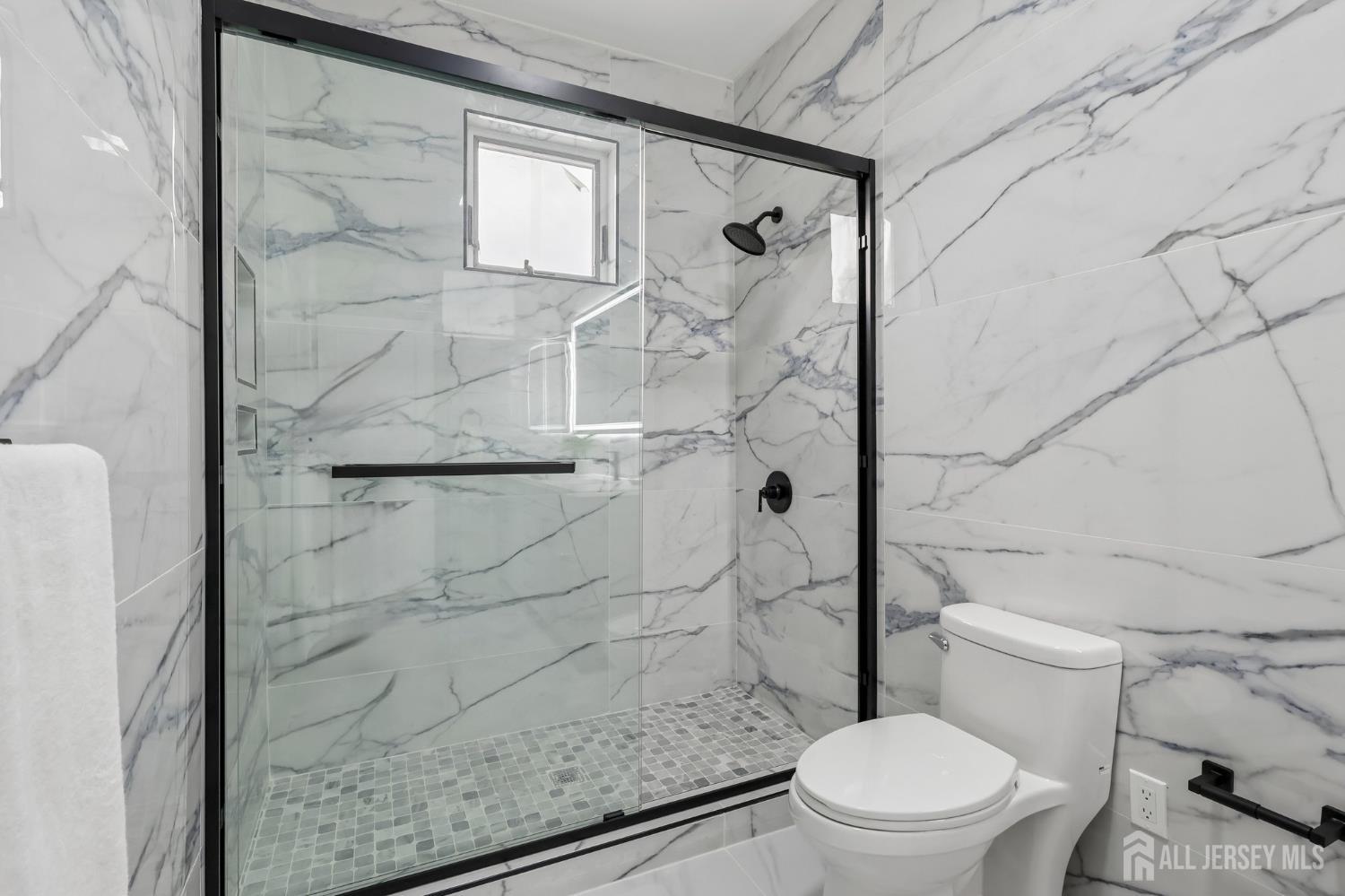 239 Suttons Lane Edison, NJ 08817 - Photo 44 of 68 a white toilet sitting next to a shower