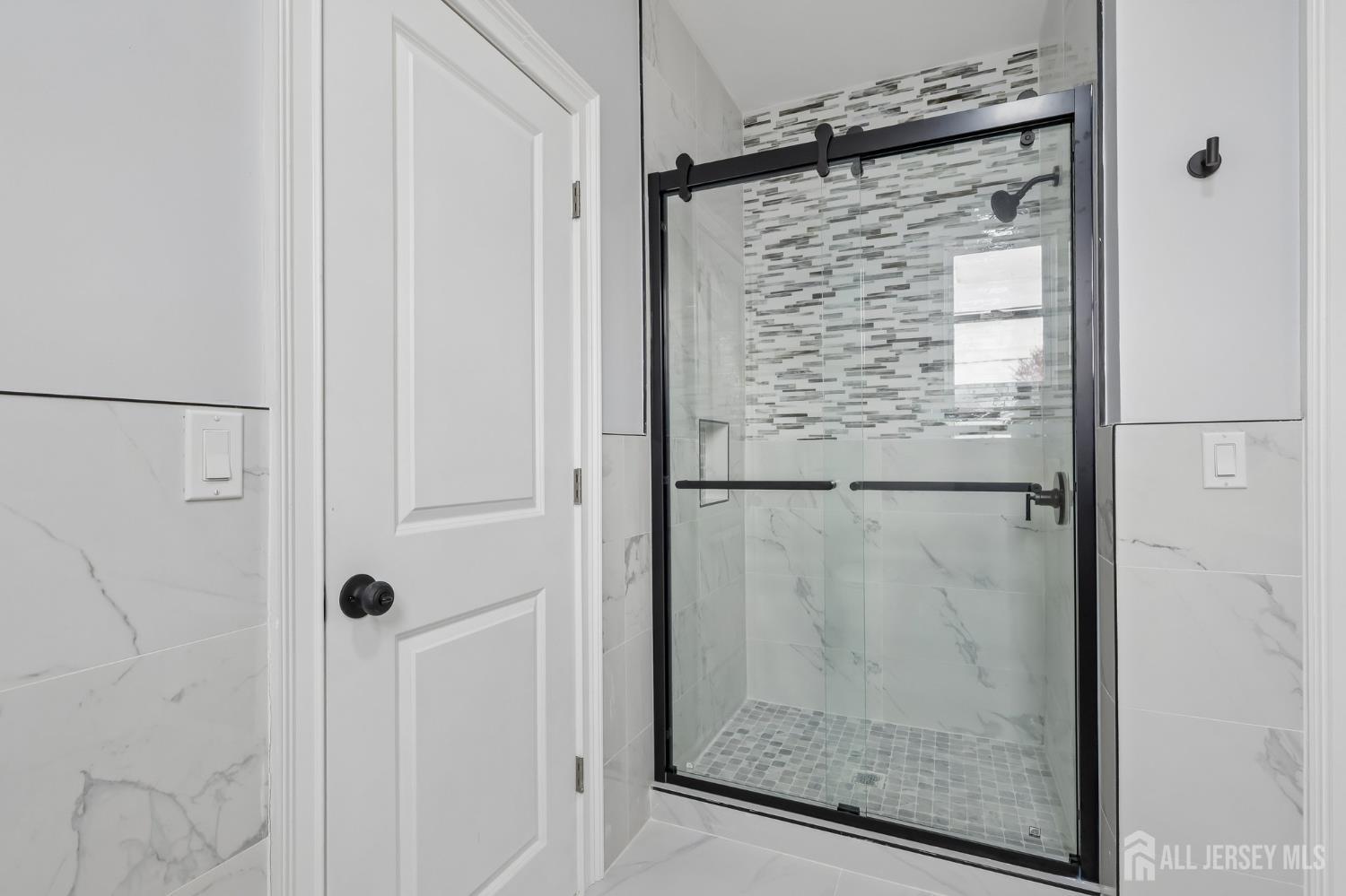 239 Suttons Lane Edison, NJ 08817 - Photo 48 of 68 a bathroom with a shower