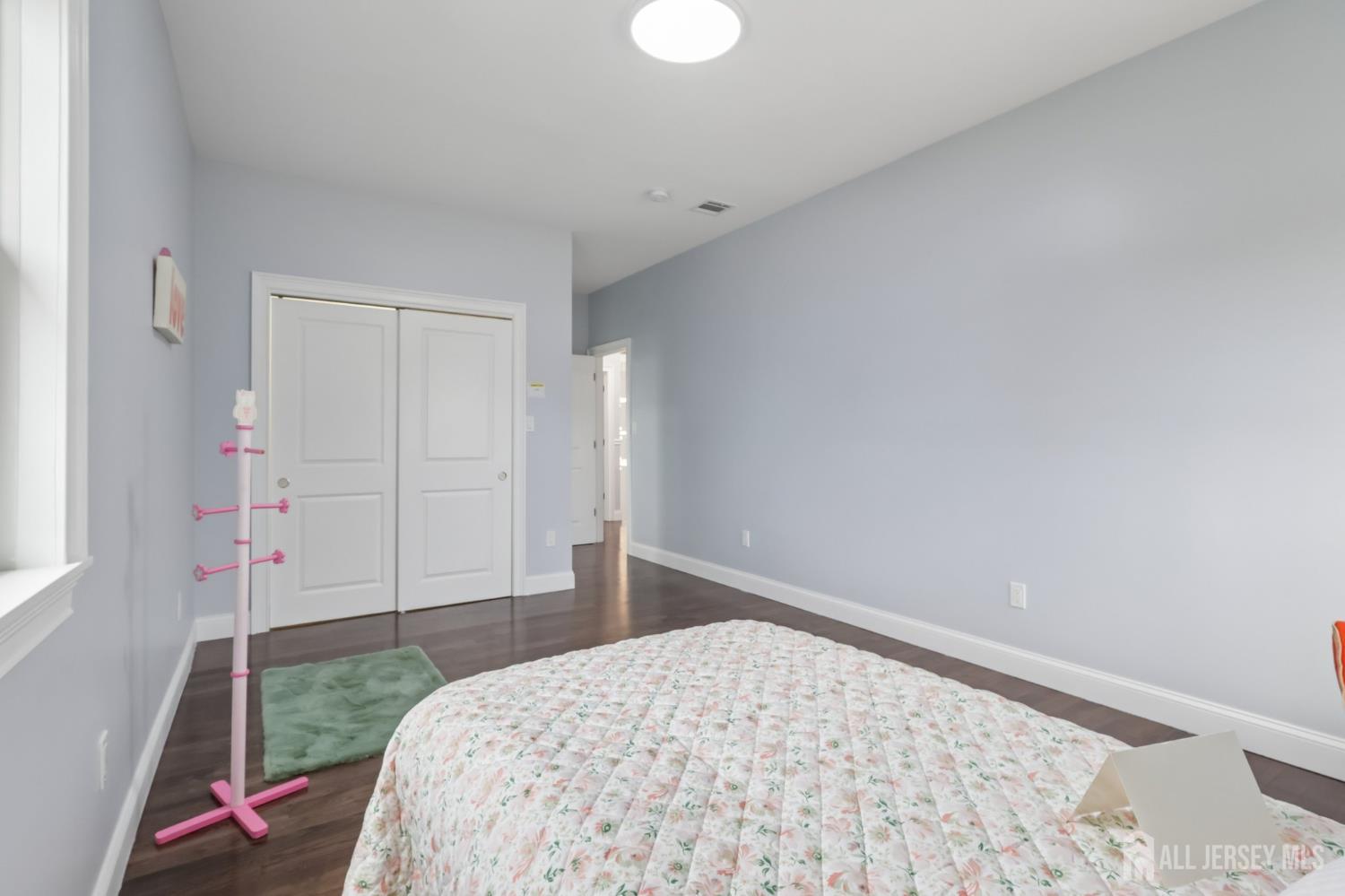 239 Suttons Lane Edison, NJ 08817 - Photo 61 of 68 a bedroom with a bed and a window