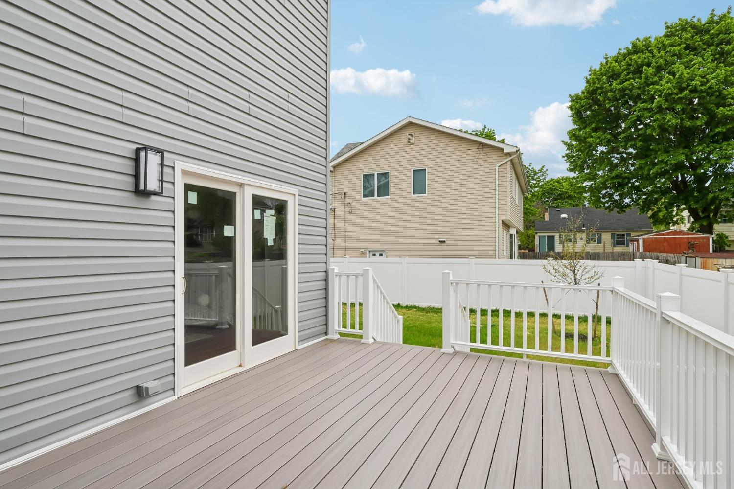 239 Suttons Lane Edison, NJ 08817 - Photo 65 of 68 a view of a house with a patio