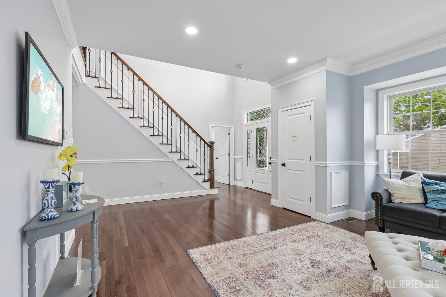 239 Suttons Lane Edison, NJ 08817 - Photo 10 of 68 a view of entryway and hall with wooden floor