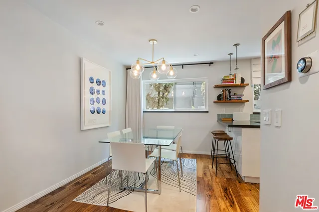 a view of kitchen with cabinets and wooden floor