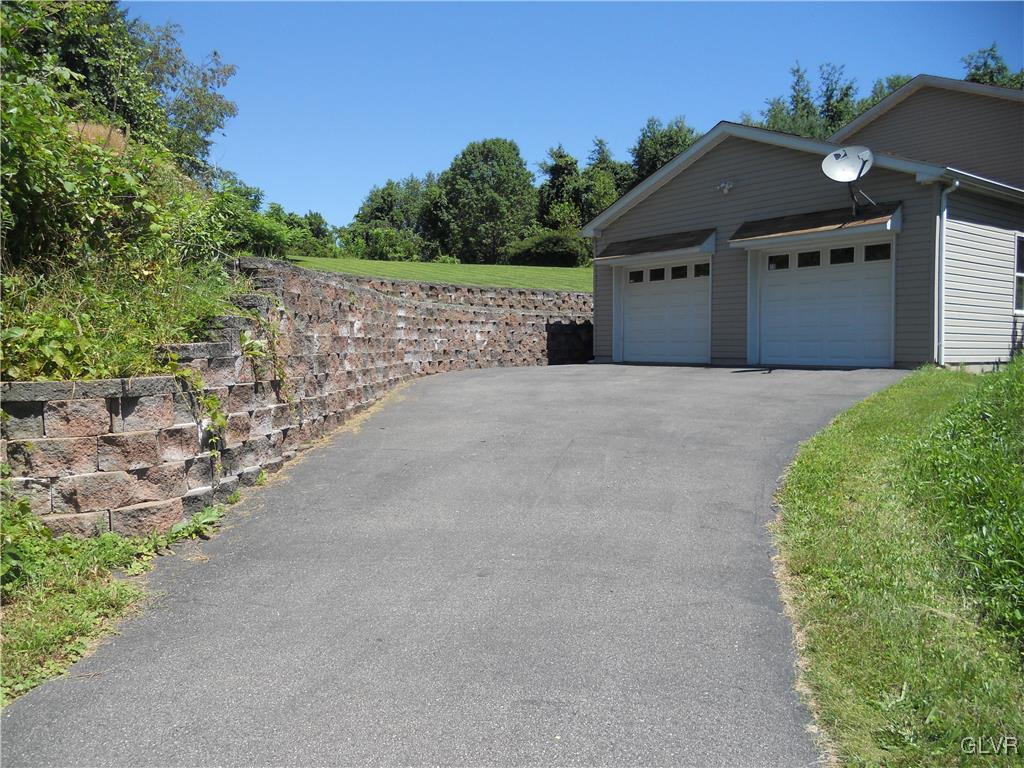 568 Allegheny Road Mount Bethel, PA 18343 - Photo 2 of 36 Landscape stone & a tar driveway lead to the garag