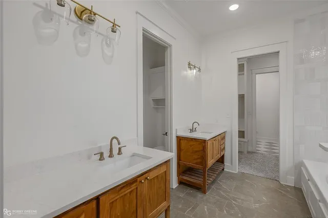 a bathroom with a sink a vanity and a mirror