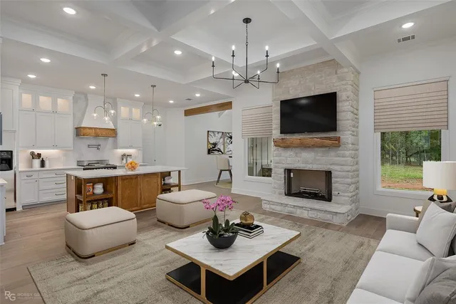 a living room with furniture a fireplace and a flat screen tv