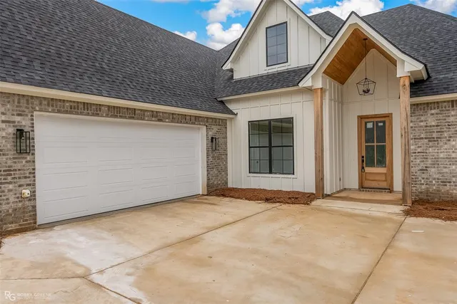 a front view of a house with a garage
