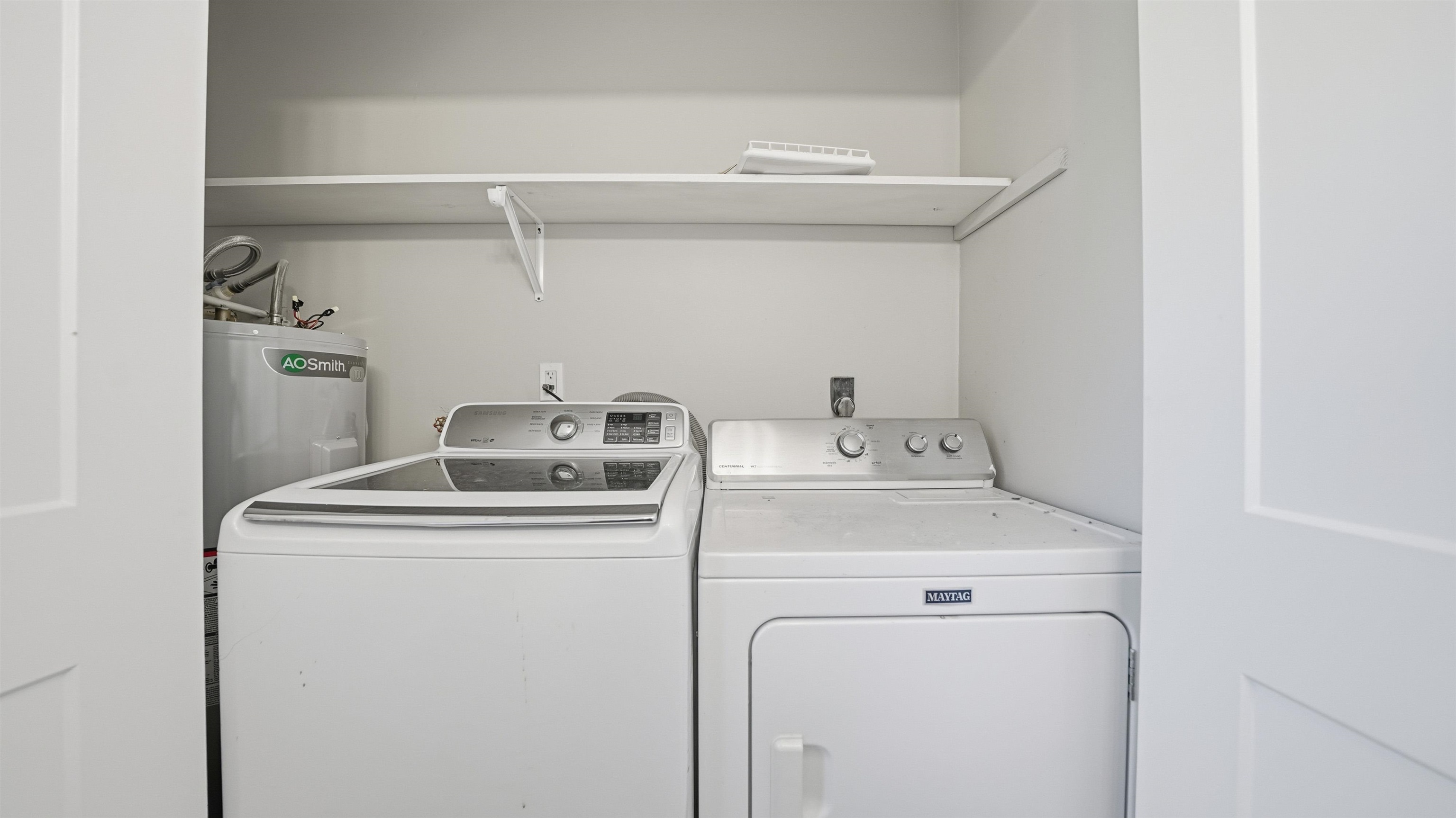 811 Hymon Circle Bunnell, FL 32110 - Photo 18 of 32 a utility room with dryer and washer