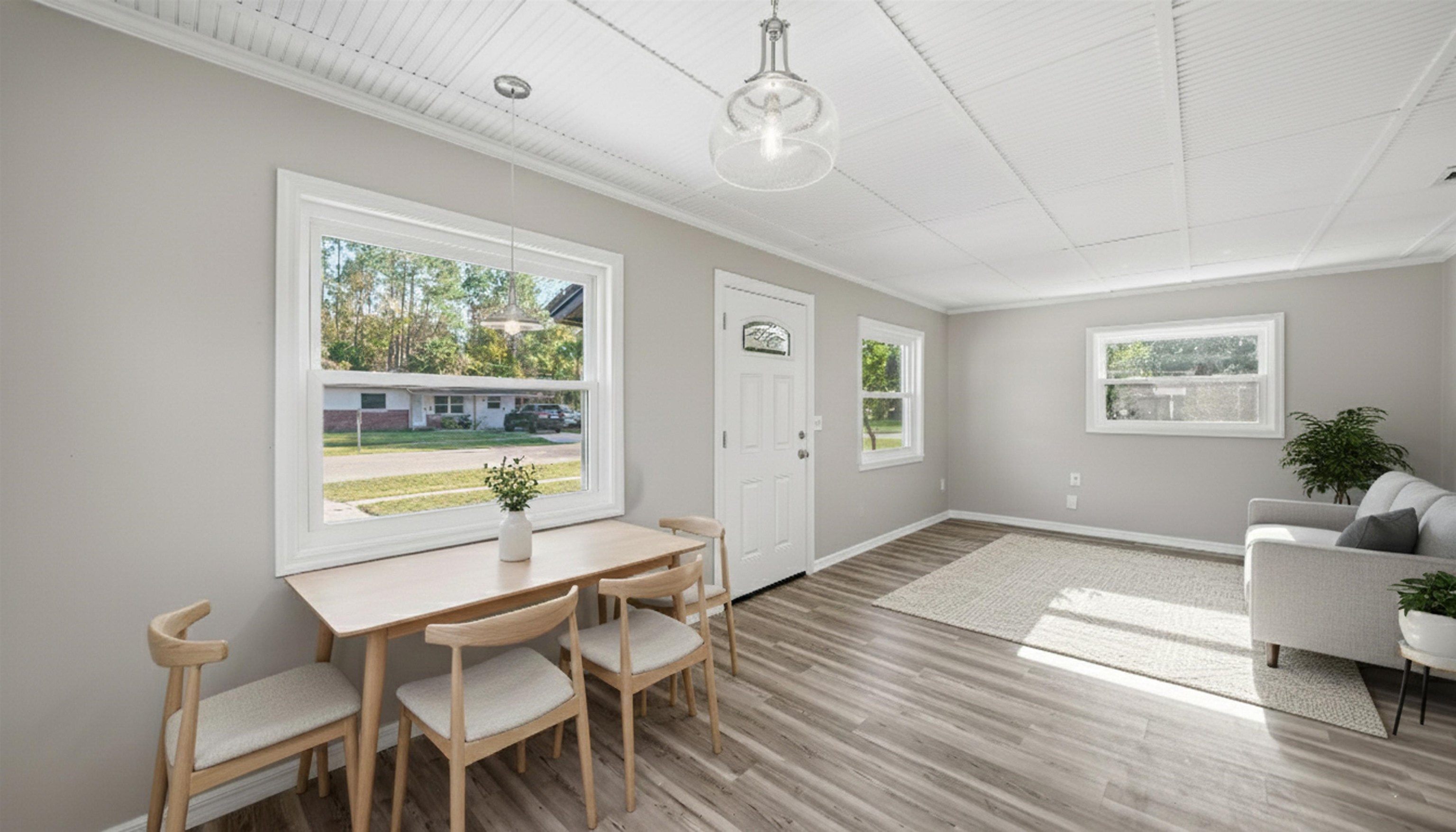 811 Hymon Circle Bunnell, FL 32110 - Photo 2 of 32 a workspace with wooden floor and windows