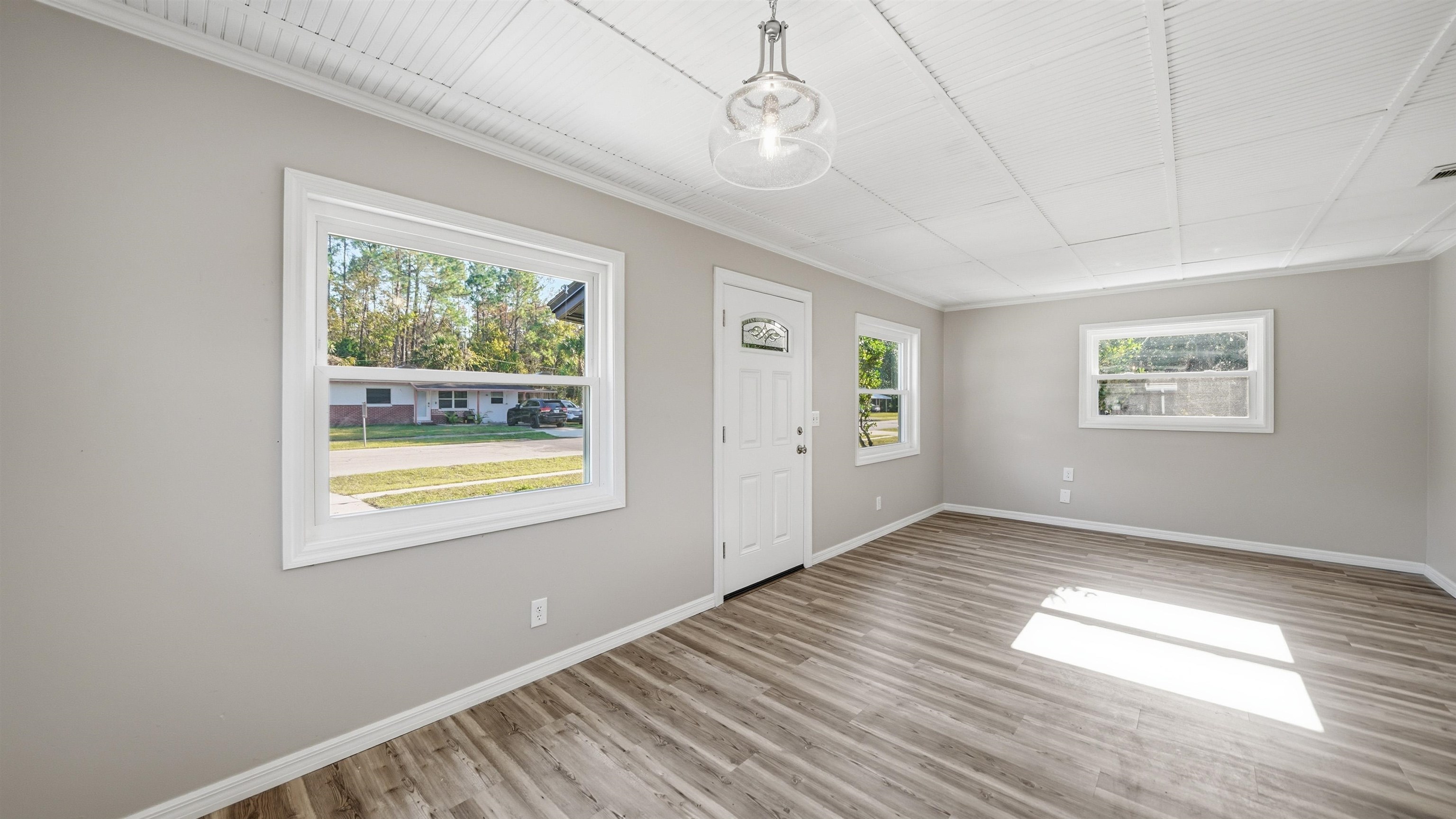 811 Hymon Circle Bunnell, FL 32110 - Photo 20 of 32 Entrance foyer featuring ornamental molding and wood finished floors
